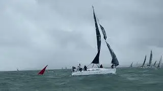J109 trawls a spinnaker at the leeward mark