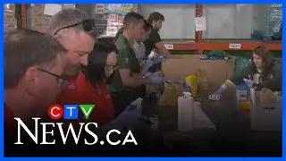 Edmonton Elks sort donations at Edmonton's Food Bank