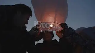 Releasing a burning sky lantern on basis of makar sankranti