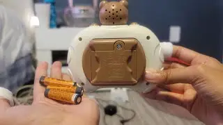 changing the batteries in the bear pop it game for my gen alpha lil sis so scoring mode works