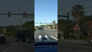 Jeep doing a balancing act with box on its head /roof while moving