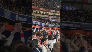 Arsenal fans celebrating in front of Real Madrid fans.  #ArsenalFans #Gunners #ARSRMA