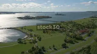 Drone Shot Over Liberty State Park With Ellis Island And The Statue Of Liberty In Background, New Yo