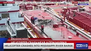 Helicopter crashes into Mississippi River barge