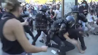 Clashes between police and protesters on the sidelines of the union march in Paris