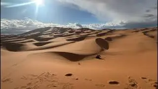 Rubina sand boarding on Erg Chebbi dunes Sahara Morocco