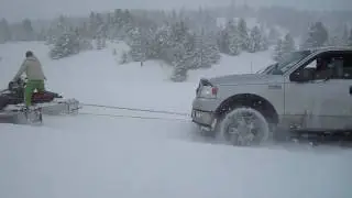 Jesse Csincsak Pulling a Truck with 1000cc Snowmobiles
