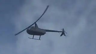 Robinson R44 Raven II G-OTRT flying over Great Hollands from Fairoaks