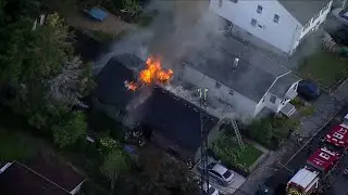 Crews battle house fire in Medford