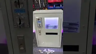 Coin-operated pen vending machine. Sells pens in one color only. Accepts specific coins.