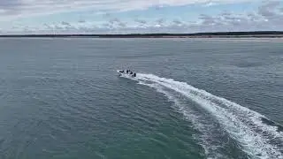 Atlas Boatworks 23F bay boat skirts a school of false albacore