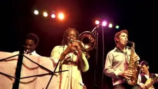 Tim Watson plays reggae with horn section.