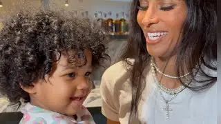 Amora helping Ciara put on her makeup
