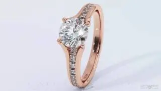 Four claw rose gold round centred diamond set with side princess cut small diamonds