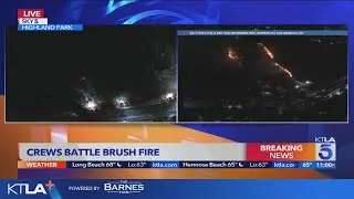 LAFD battles brush fire in Highland Park