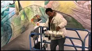 Robert Maja working on the SLO Library Atrium Mural