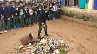 The students of Rising Model School learning how to identify the different kinds of wastes