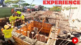 Заливка бетона для блочных стен лифта с помощью каменщиков Big Island Hawaii