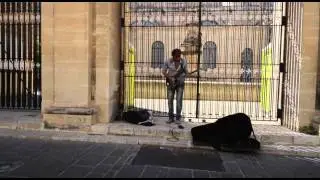 Street musician plays awesome electric guitar solo in Malta
