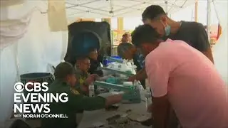 Inside processing center handling influx of migrants