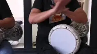 Bodybuilder playing darbuka