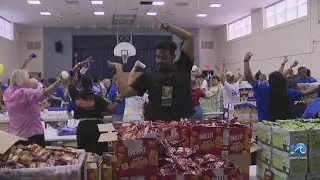 Mercy Chefs, Washington Commanders player, distributing backpacks in Virginia Beach