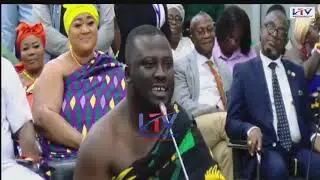 Ashanti Regional Minister Designate Dr. Frank Amoakohene explains the meaning of his Kente cloth..