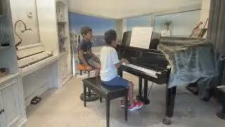 Joseph performs and sings with brother Joel 