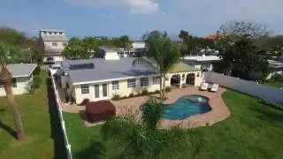 Free form pool with summer kitchen