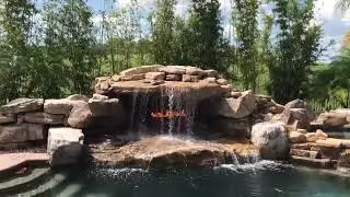 Epic Backyard Oasis: Stunning Waterfall Pool with Fire Feature! 🔥💦