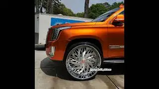 Kandy orange Cadillac Escalade on 32s with that loud pack