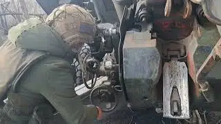 Russian Msta B howitzers strike a Ukrainian command center in a damaged house
