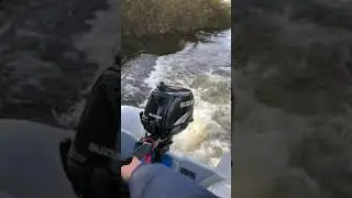 4hp Suzuki outboard on river