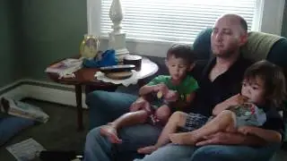 Robu in living room chair with Tyler and Jason watching TV 08/12/2011