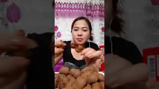 eating fresh sweet (TAMARIND)