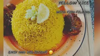 Fish fillet rolls with vegetables filling and yellow rice