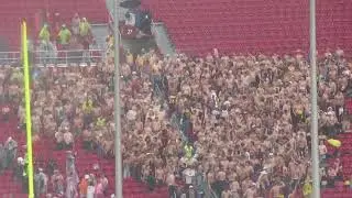 At the USC vs Iowa football game, in the fourth quarter a mass of shirtless Trojan men gathered.