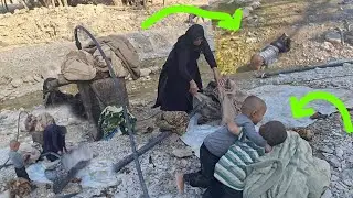 Nomadic family tradition: washing nomadic rugs and blankets by the river