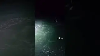 Floodlight Captures Two Massive Shark Tails Near Boat | Real Ocean Footage