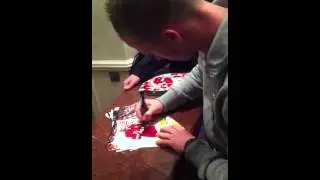 Manchester United player Alexander Buttner signing autographs at team hotel