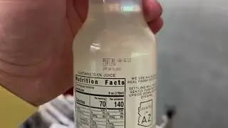 SNEED-JET&reg; Titan Thermal Inkjet Printer Printing Three Lines on Glass Bottle