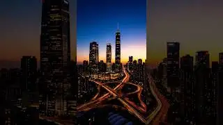 In timelapse, the city unveils itself, emerging from the shadow of night into the clarity of day.