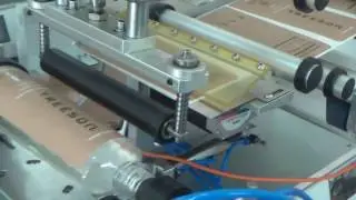 Semi auto bench top label applicator with rolling system for plastic oval bottles