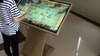 Play social games with interactive touch table terminal