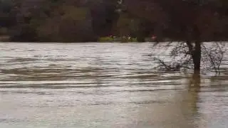 American River flowing over foot bridge. February 9, 2017