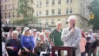 Ciaran O'Reilly founder of Irish Rep Theatre NYC speaking at the corner of Malachy McCourt Lane