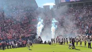 Denver Broncos enter Mile High Stadium 