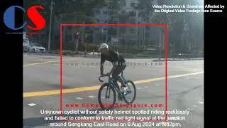 Unknown Cyclist Without Helmet Spotted Failing To Conform To Traffic Red Light Signal