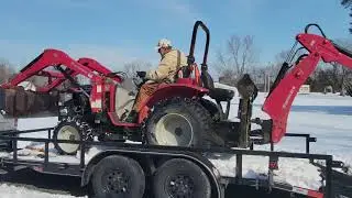 RESCUE ME:  TRACTOR with a CHAIN PULLS the F-150 from the ICE and SLUSH  #rescueme #stuck #f150