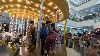 ZarrieDara riding a carousel @MOA